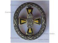 Austria Hungary WWI Cap Badge Yellow Black Cross for War Aid with Laurel