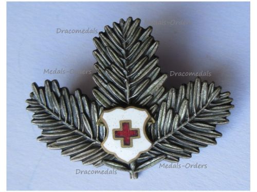 Austria Hungary WWI Cap Badge Red Cross with Pine Branches